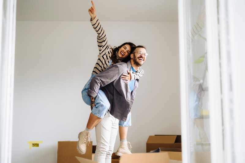Happy couple in their new apartment in Houston