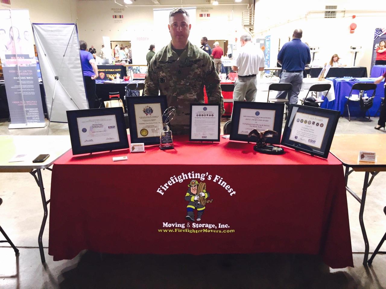 military personnel standing behind awards
