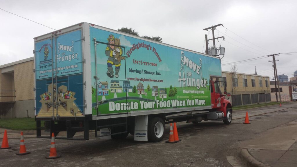 Firefighting's Moving & Storage Truck Donating Food Showcasing Community Involvement in Texas