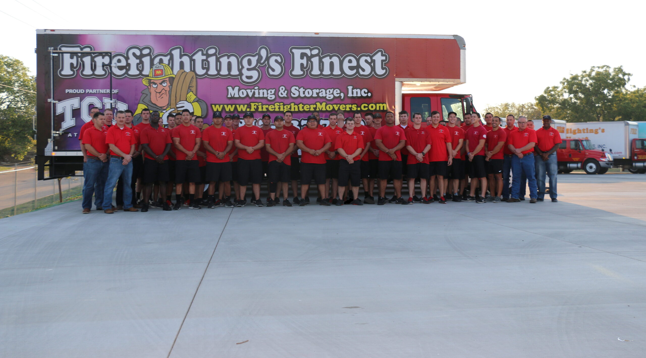 Firefighting's Finest moving crew and staff posing for team picture
