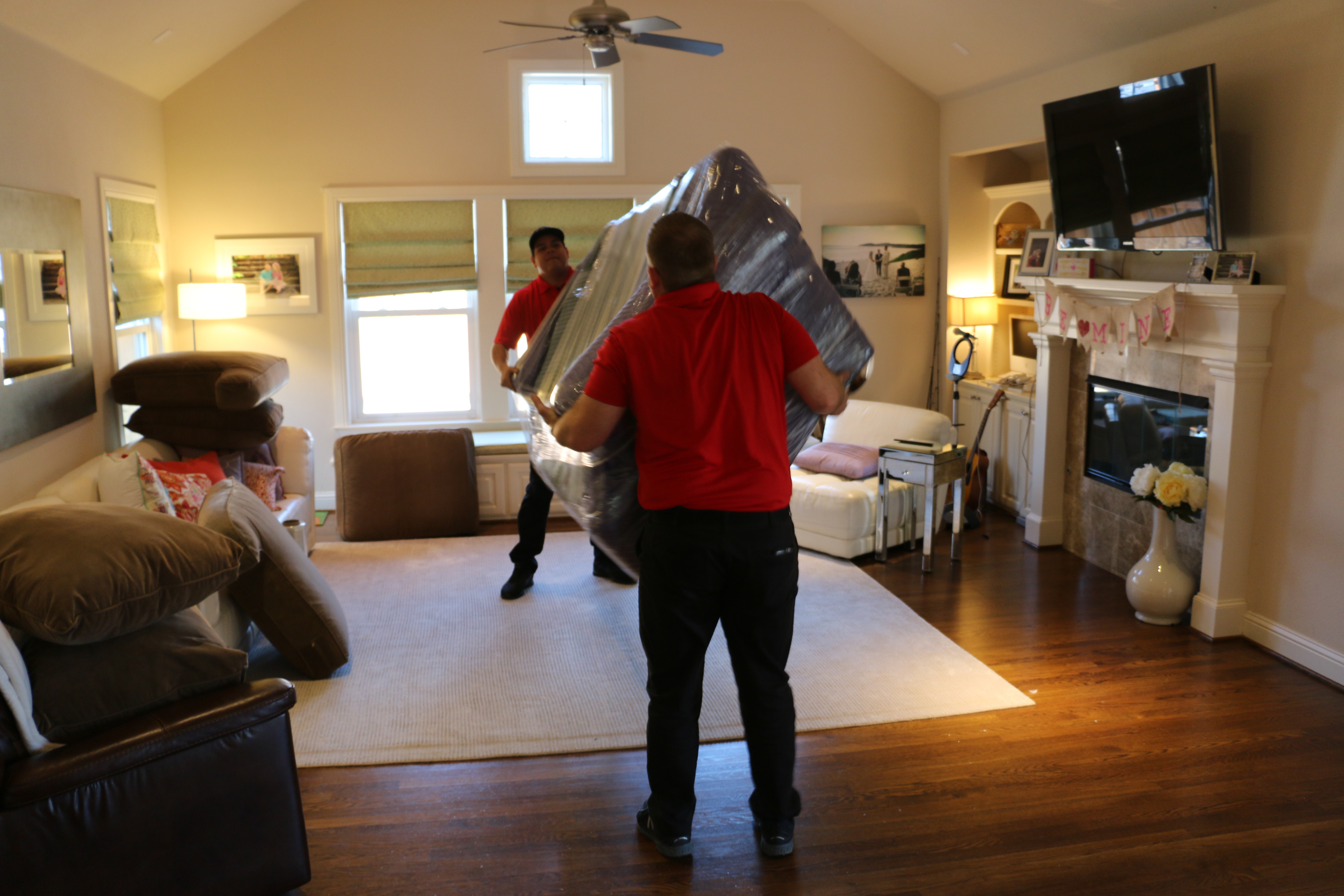 Full Service Moving Company In Texas - 2 Firefighting's Finest Moving & Storage guys moving a couch