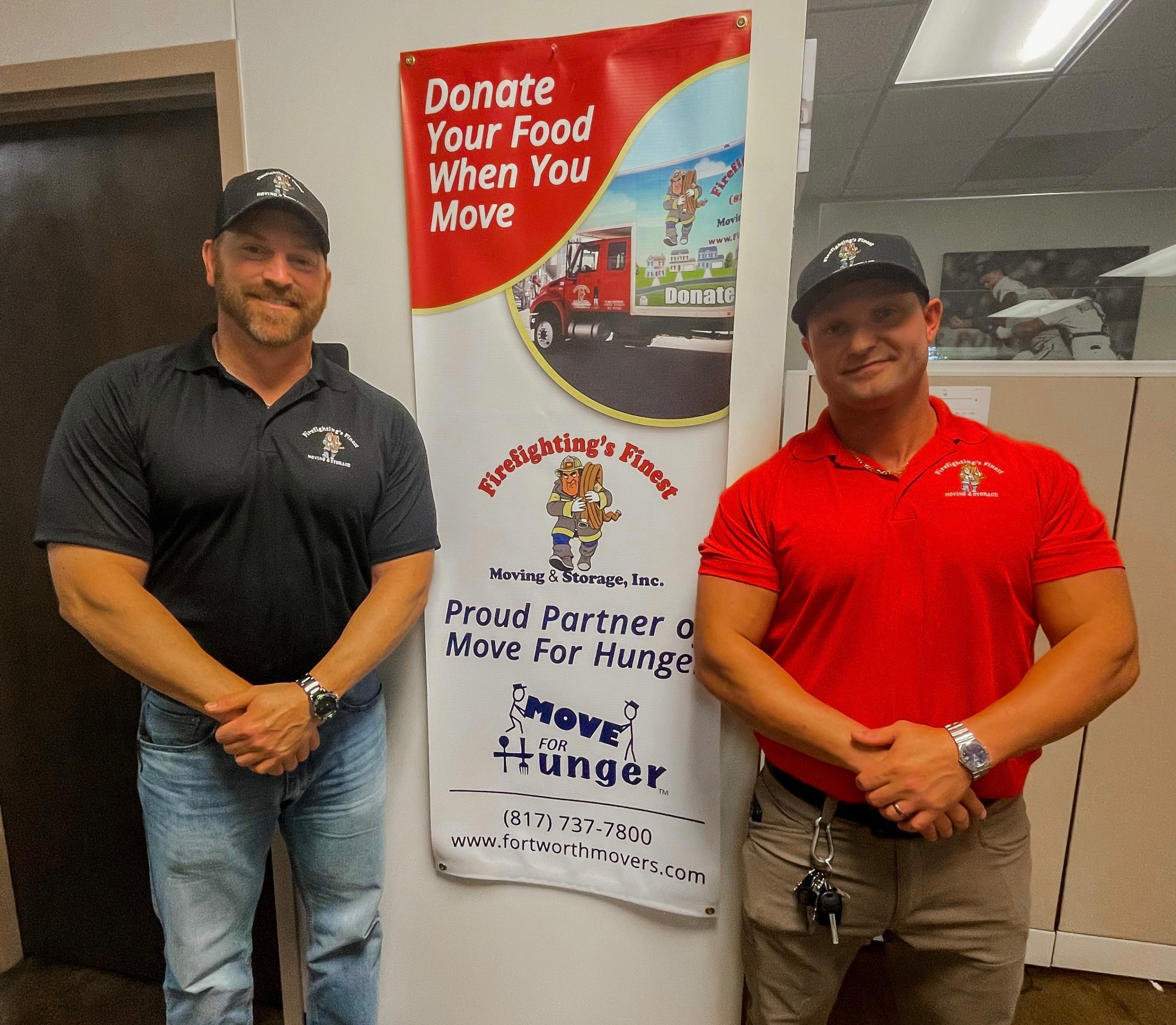 Two men promoting the Move for Hunger partnership at Firefighting’s Finest Moving & Storage in Texas