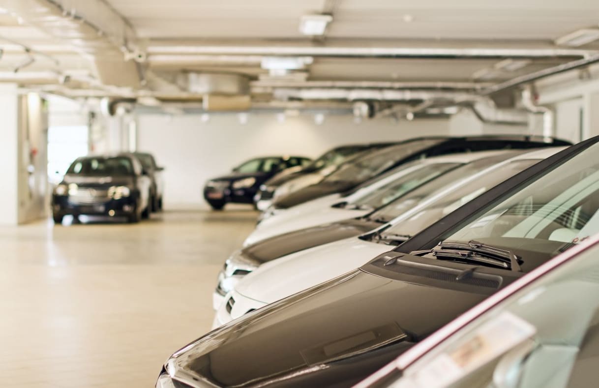 A row of cars in a garage