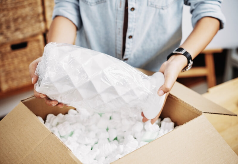 Fragile items being packed for moving in Texas