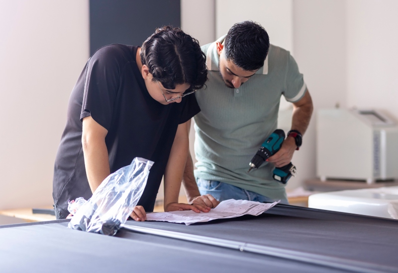 People reading how to take apart a pool table to move it in Texas