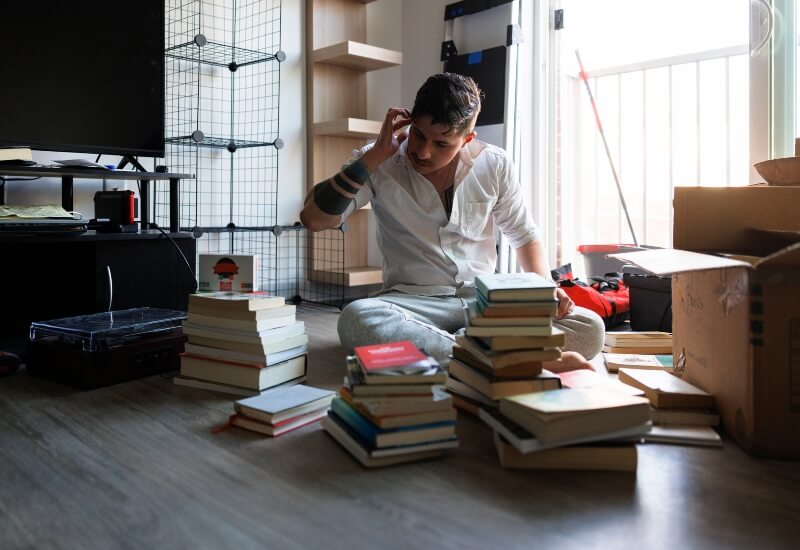 A person decluttering their house for moving in Texas